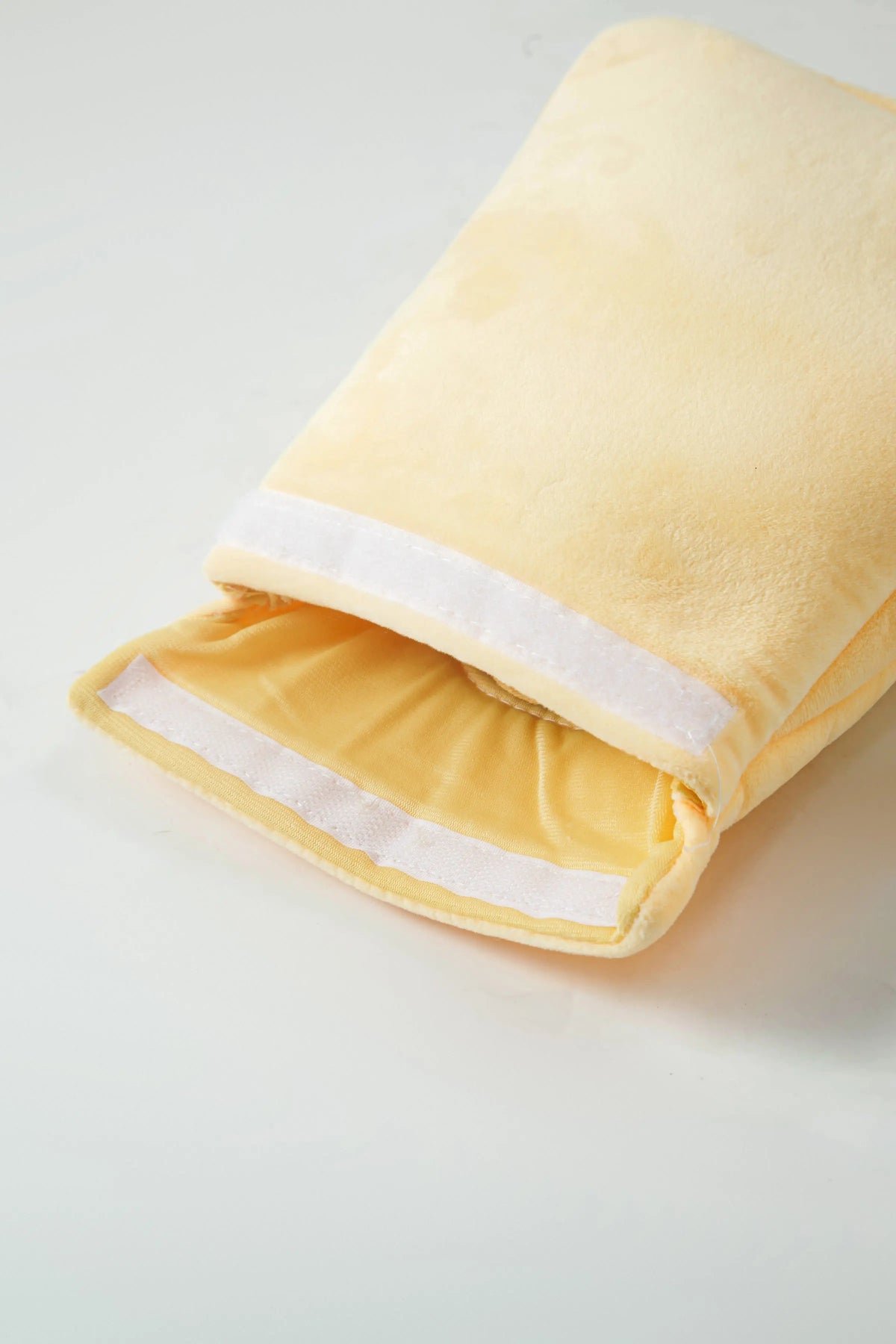 Close-up of the Afternoon Tea plush pouch closure and soft fabric
