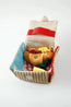 Close-up of the Picnic Paws snuffle mat with its plush croissant toy
