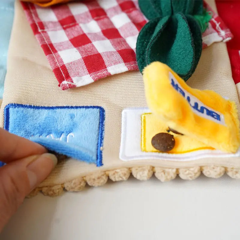 Close-up of the hidden-treat flap pocket on the Picnic Paws snuffle mat